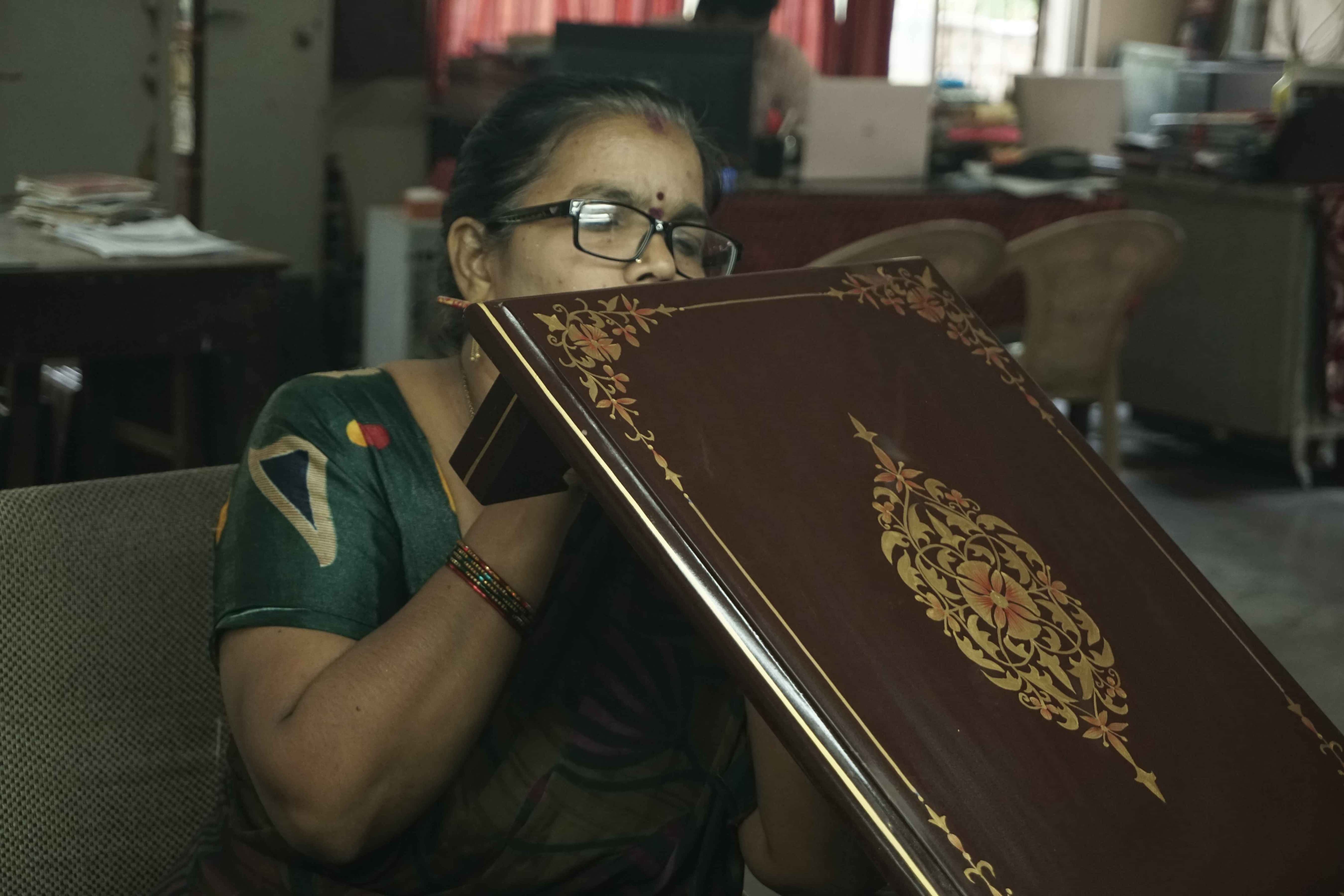 Artisan crafting traditional artwork
